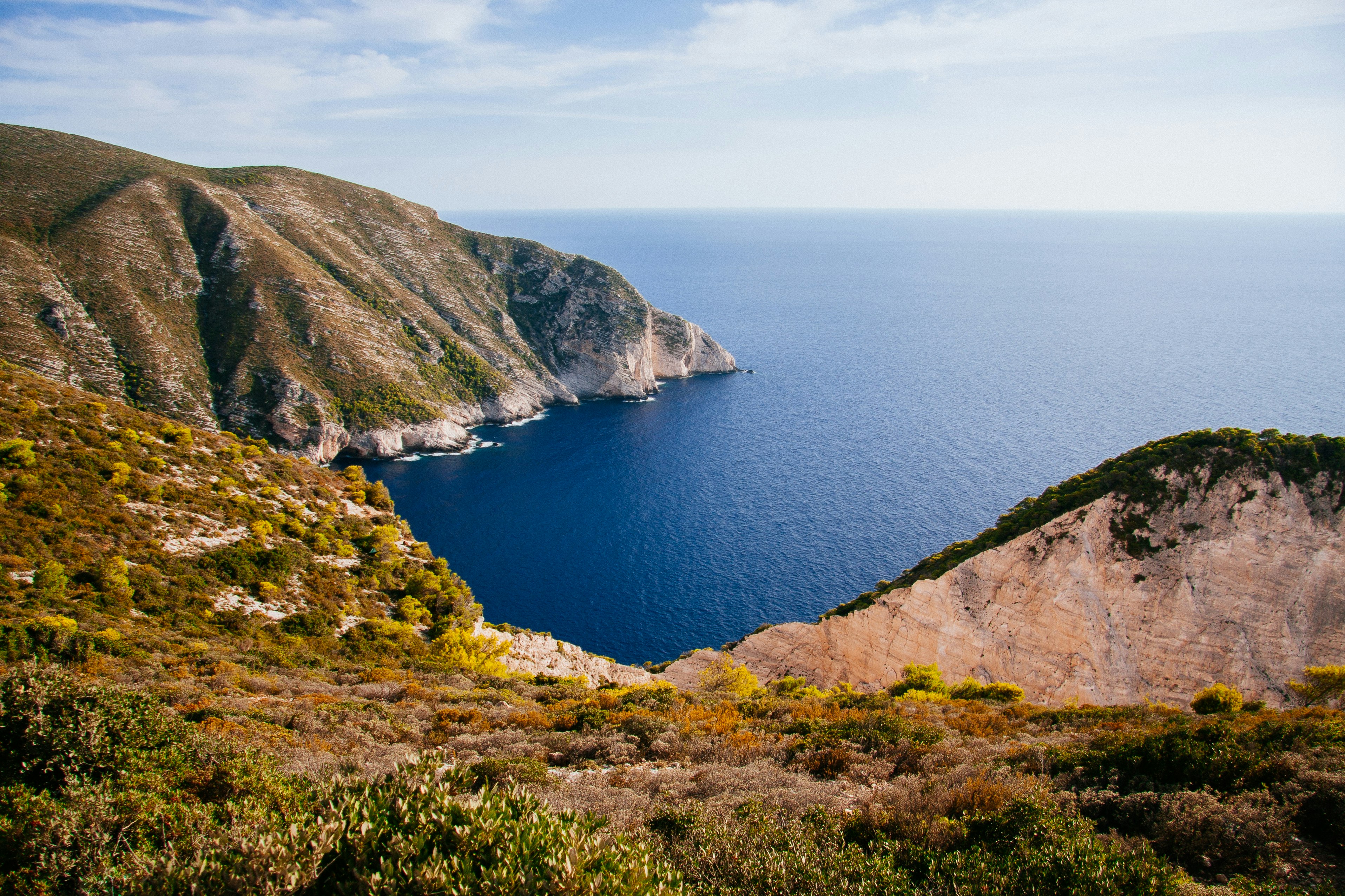 landscape of mountain near ocean